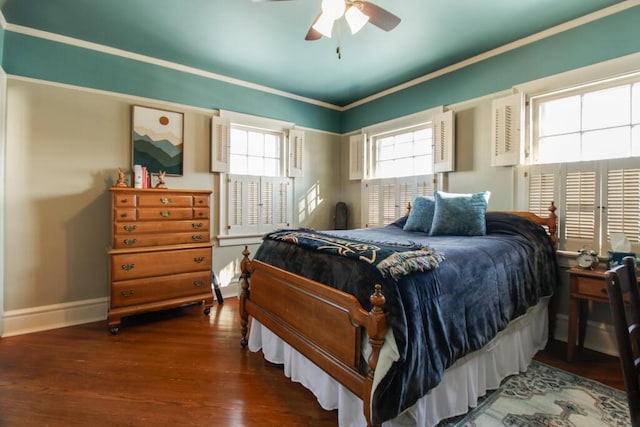 bedroom featuring crown molding, ceiling fan, and dark hardwood / wood-style flooring