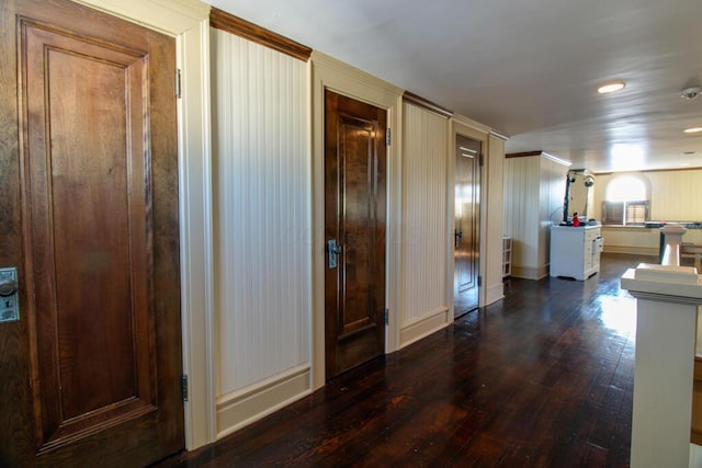 corridor featuring dark hardwood / wood-style floors