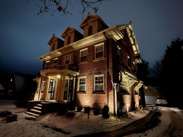 view of front of house featuring a balcony