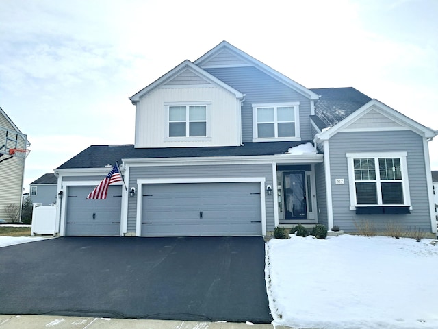 view of front of property with a garage