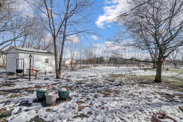 view of yard layered in snow