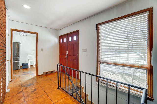 entrance foyer featuring light parquet floors