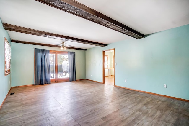 unfurnished room featuring beam ceiling and ceiling fan