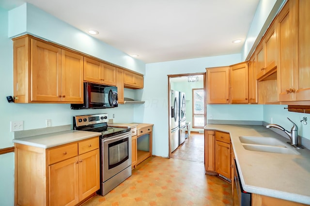 kitchen with appliances with stainless steel finishes and sink