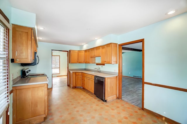 kitchen with stainless steel range with electric stovetop, sink, and dishwasher