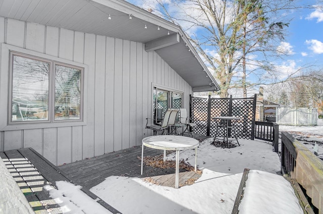 view of snow covered deck