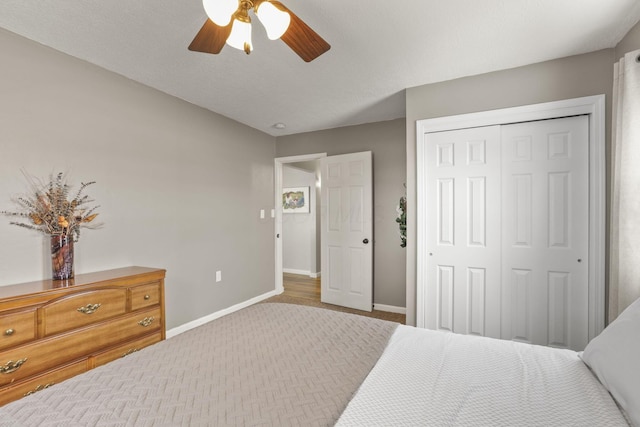 bedroom featuring ceiling fan and a closet