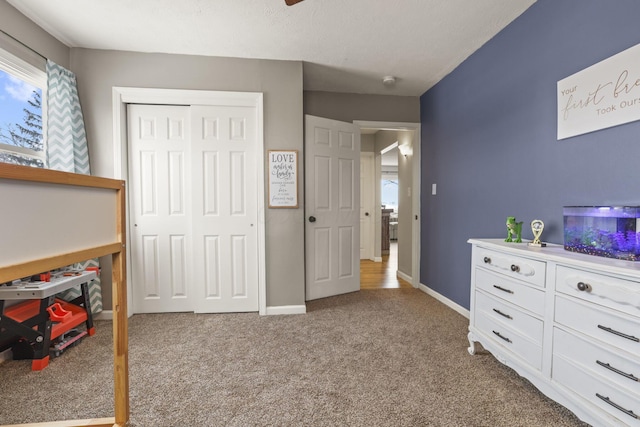 bedroom with carpet and a closet