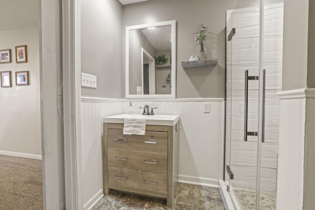 bathroom featuring vanity and a shower with shower door