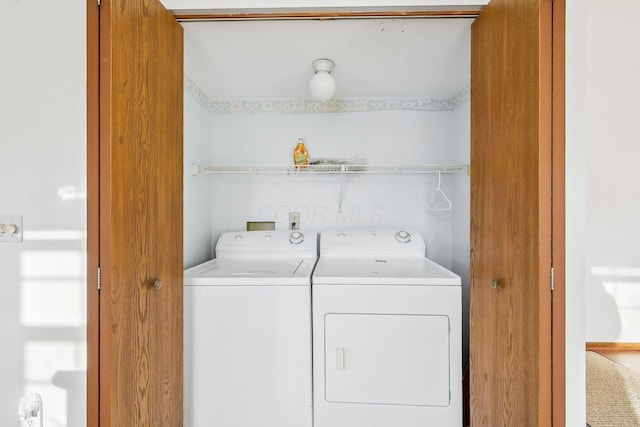 laundry area with washing machine and dryer