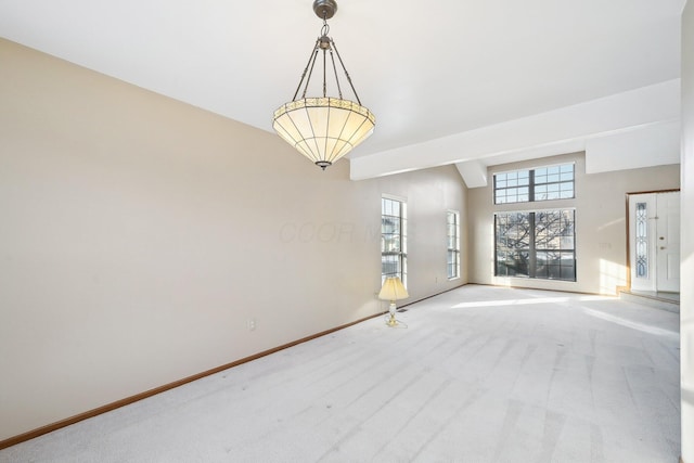 unfurnished room featuring light colored carpet