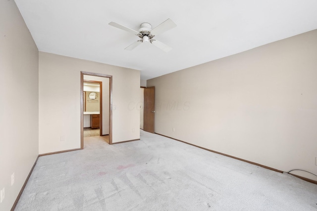 unfurnished bedroom with ceiling fan and light colored carpet