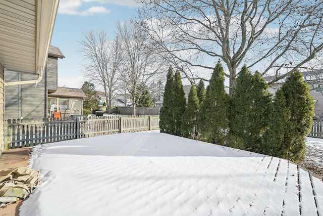 view of yard layered in snow