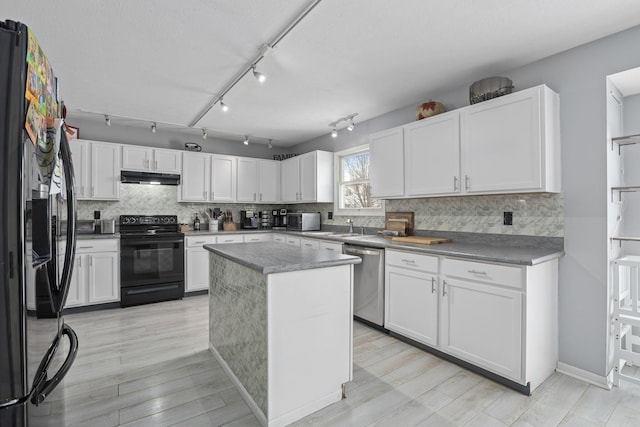 kitchen with black appliances, a center island, light hardwood / wood-style floors, white cabinets, and sink