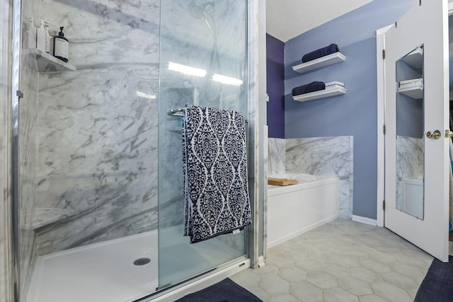 bathroom with a shower with shower door, a textured ceiling, and tile patterned floors