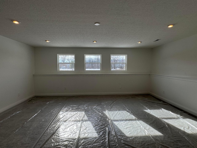 empty room featuring a textured ceiling