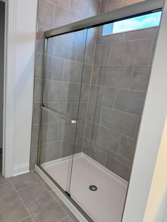 bathroom featuring tile patterned floors and walk in shower