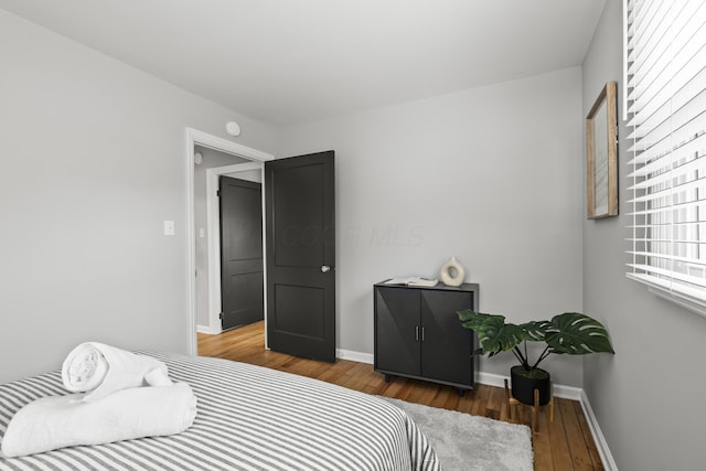 bedroom with wood-type flooring