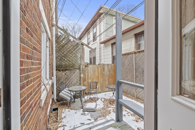 view of snow covered patio