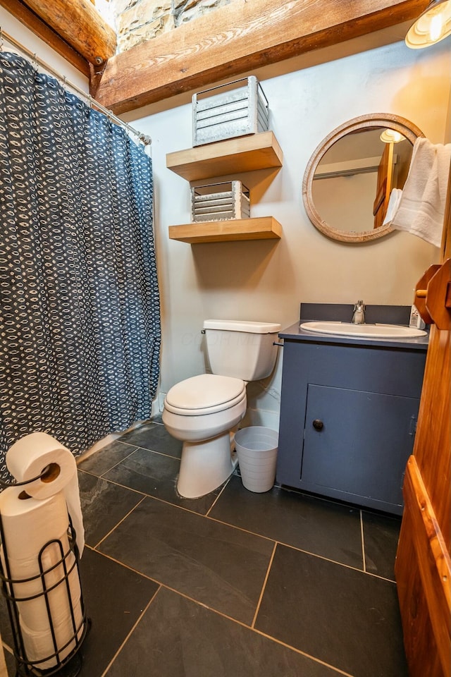 bathroom featuring vanity, toilet, a shower with curtain, and tile patterned flooring