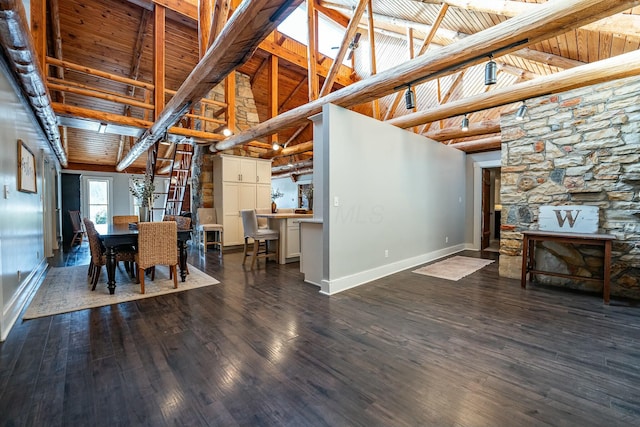 dining area featuring wood ceiling, beamed ceiling, dark hardwood / wood-style floors, and high vaulted ceiling