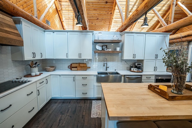 kitchen with white cabinets, backsplash, and sink