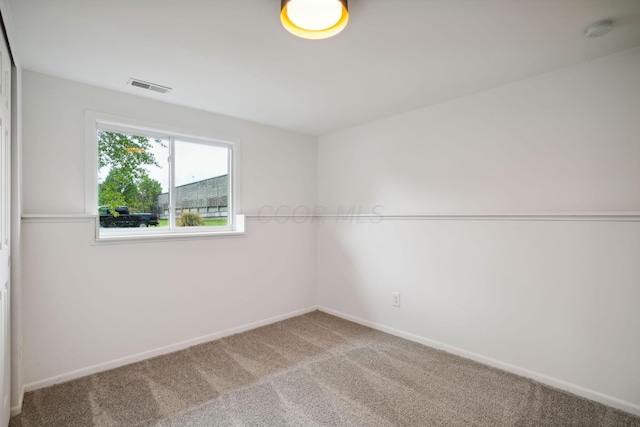 spare room featuring carpet flooring