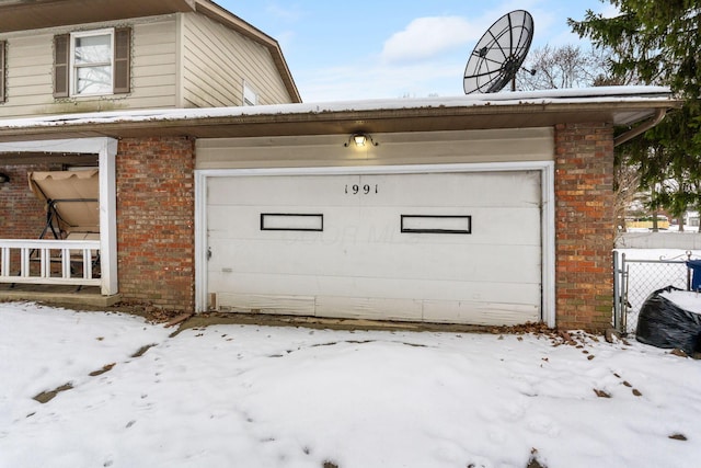 view of snow covered garage