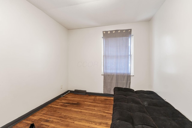 unfurnished room featuring hardwood / wood-style flooring