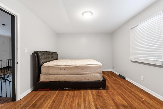 bedroom featuring dark hardwood / wood-style flooring