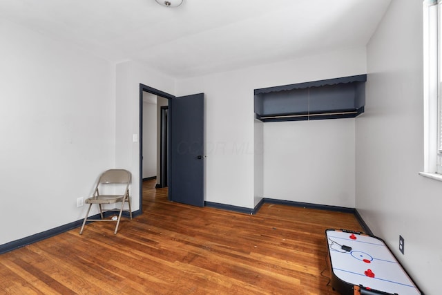 spare room featuring hardwood / wood-style floors