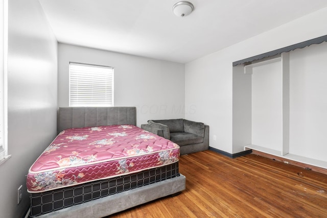 bedroom with hardwood / wood-style floors