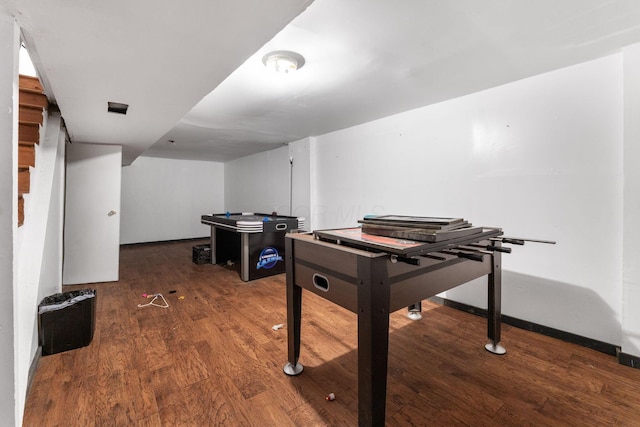 playroom with dark wood-type flooring