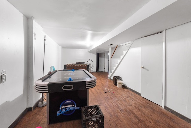 recreation room featuring dark wood-type flooring