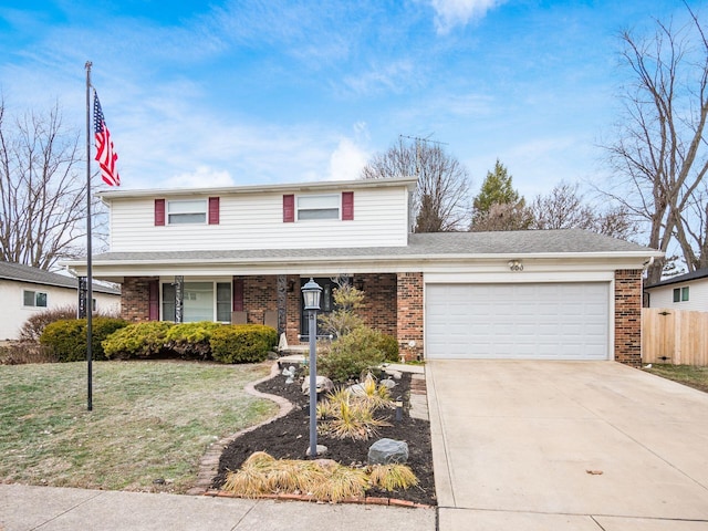 front facade featuring a garage and a front lawn