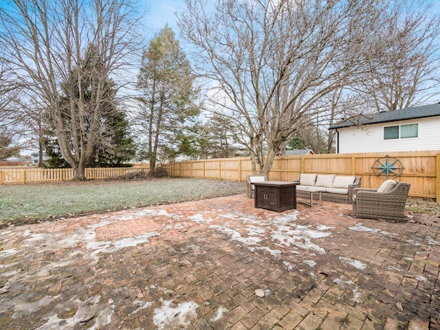 view of patio / terrace with an outdoor living space with a fire pit