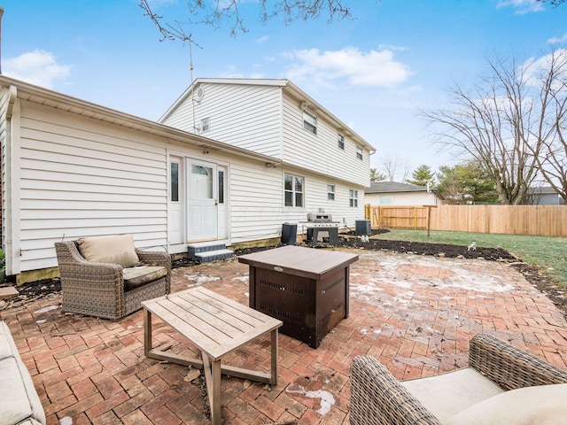 back of property with central AC unit and a patio