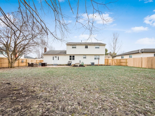 rear view of house with central AC unit, a lawn, and an outdoor hangout area