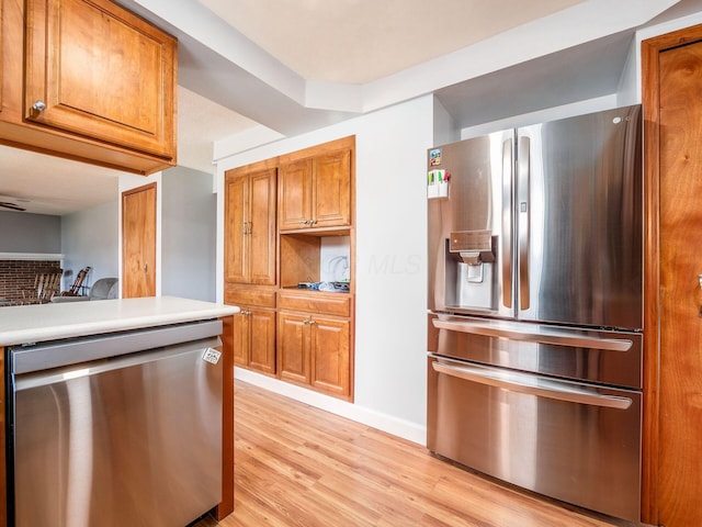 kitchen featuring appliances with stainless steel finishes and light wood-type flooring