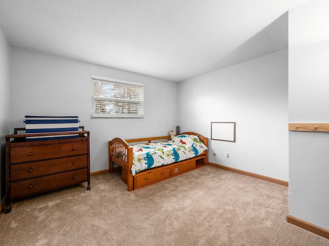 carpeted bedroom featuring a textured ceiling