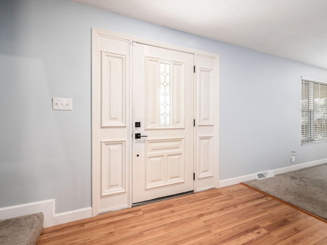 entryway with light hardwood / wood-style flooring