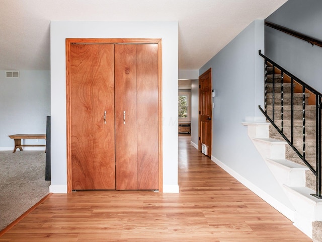 corridor featuring light hardwood / wood-style floors