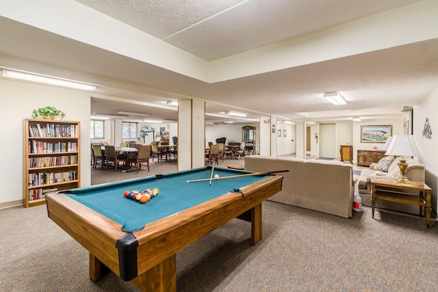 rec room featuring a textured ceiling, billiards, and carpet floors