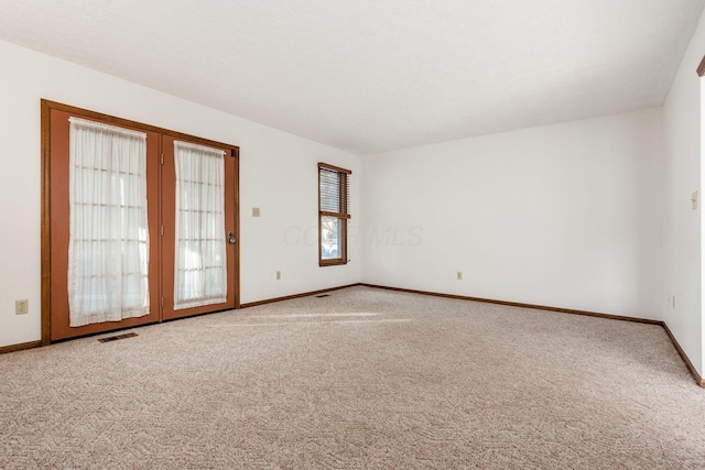 spare room with carpet floors