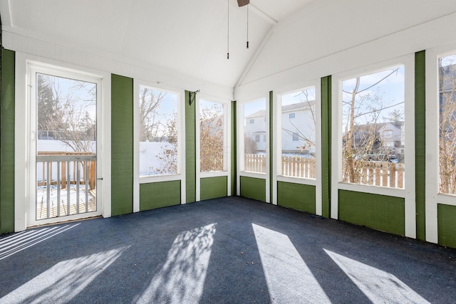 unfurnished sunroom featuring lofted ceiling