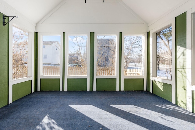 unfurnished sunroom featuring lofted ceiling