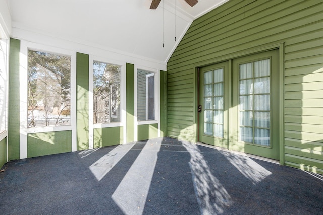 unfurnished sunroom featuring vaulted ceiling and ceiling fan