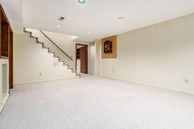 basement with light colored carpet