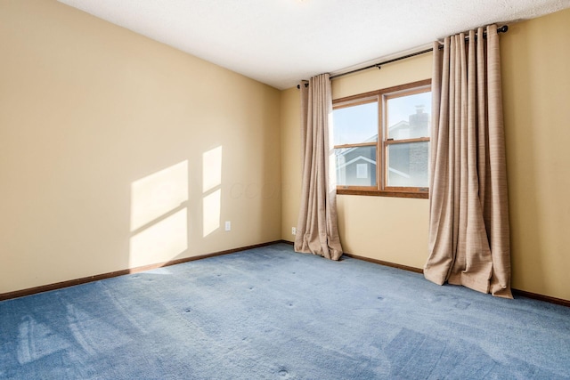 unfurnished room featuring carpet flooring