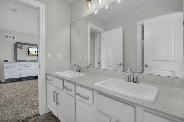 bathroom featuring vanity and a textured ceiling